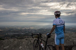 cyclist in San Marino admires the view